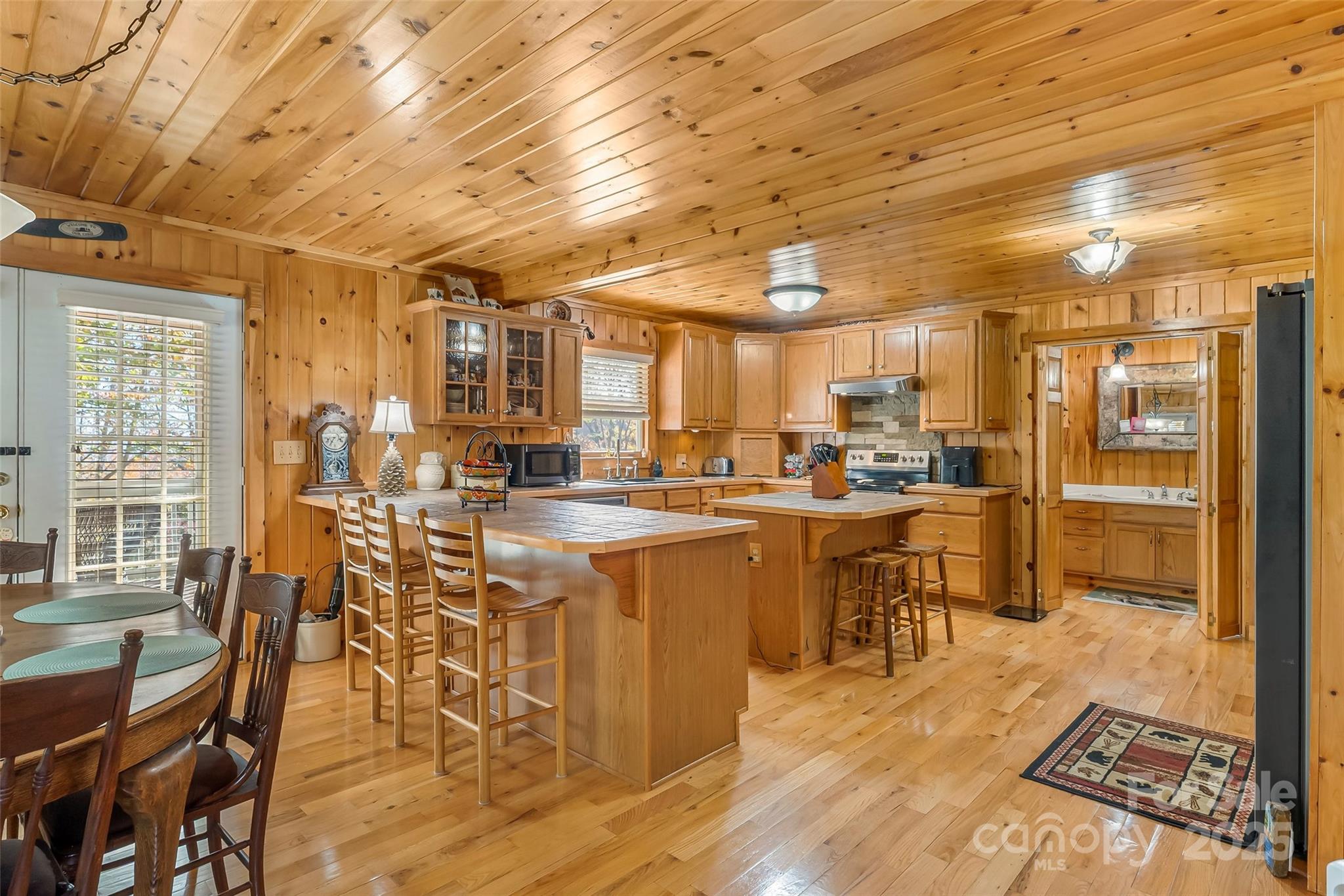 6151 Hemlock Road Newland, NC 28657 - Photo 5 of 43 a large room with lots of table chair and glass door