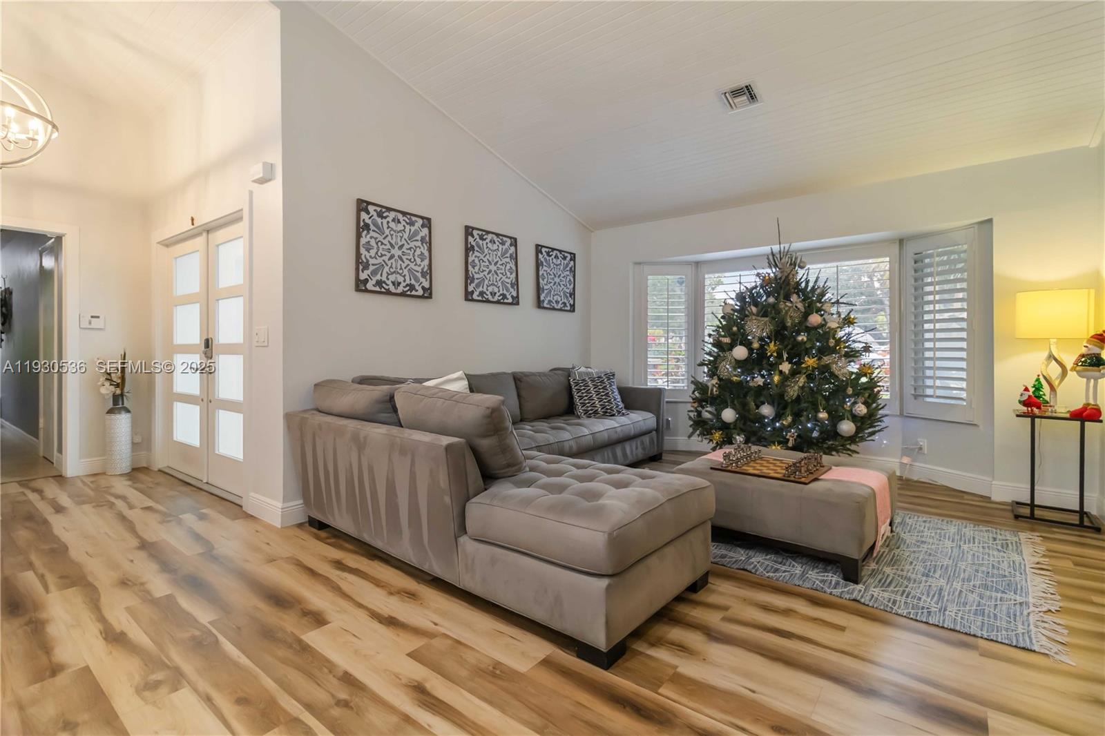 2047 Southwest 36th Avenue Delray Beach, FL 33445 - Photo 11 of 45 a living room with furniture and a window