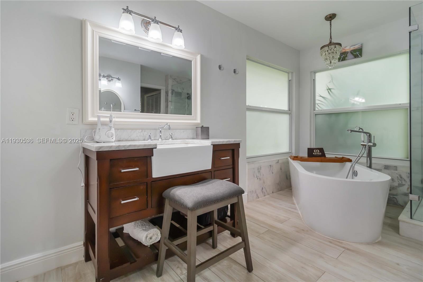 2047 Southwest 36th Avenue Delray Beach, FL 33445 - Photo 24 of 45 a view of a dining room with furniture and wooden floor