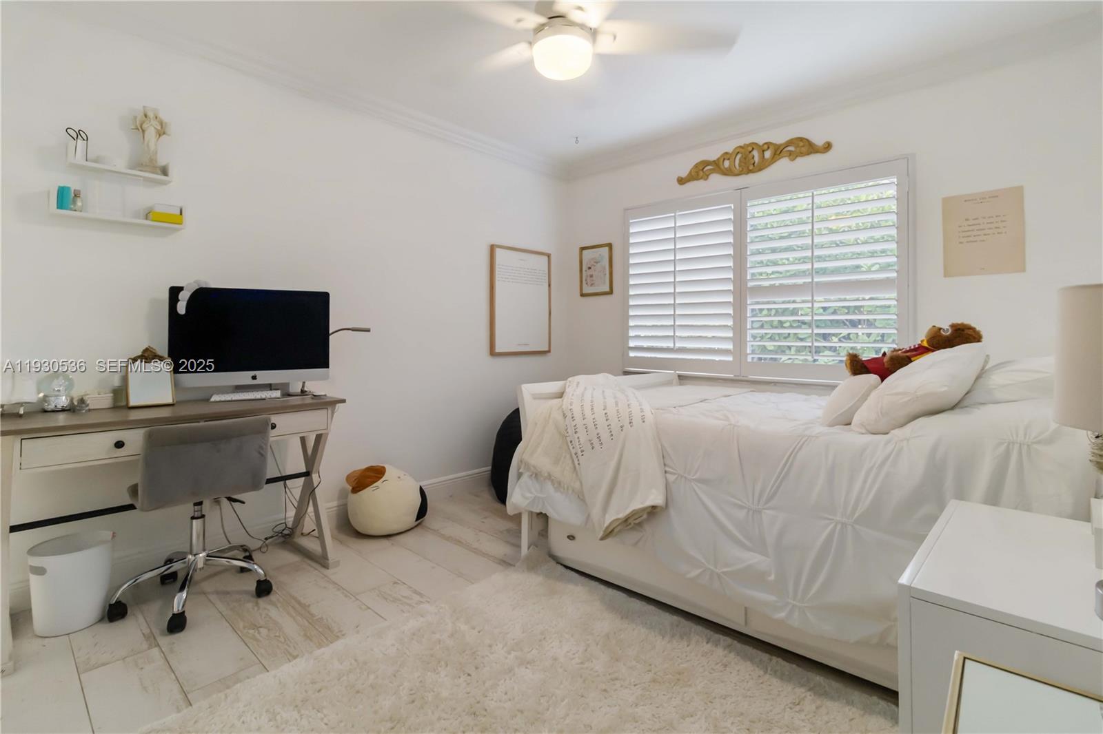 2047 Southwest 36th Avenue Delray Beach, FL 33445 - Photo 32 of 45 a bedroom with a bed and a flat screen tv