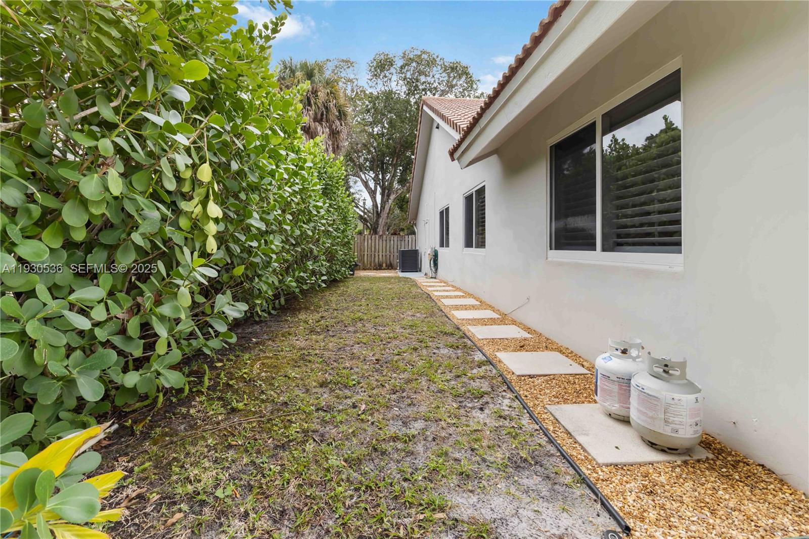2047 Southwest 36th Avenue Delray Beach, FL 33445 - Photo 37 of 45 a house view with a backyard space