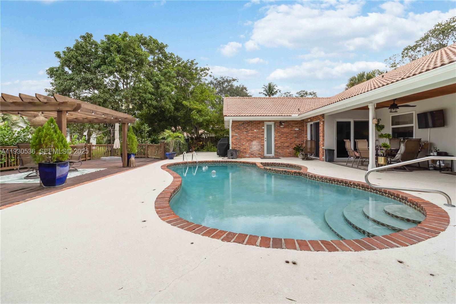 2047 Southwest 36th Avenue Delray Beach, FL 33445 - Photo 39 of 45 a view of a house with swimming pool