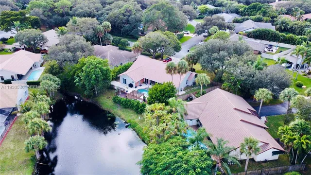 an aerial view of a houses with outdoor space and street view