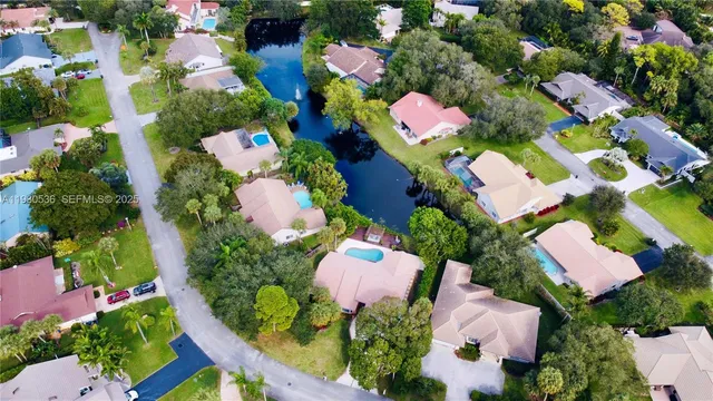a view of a lake with a house in the background