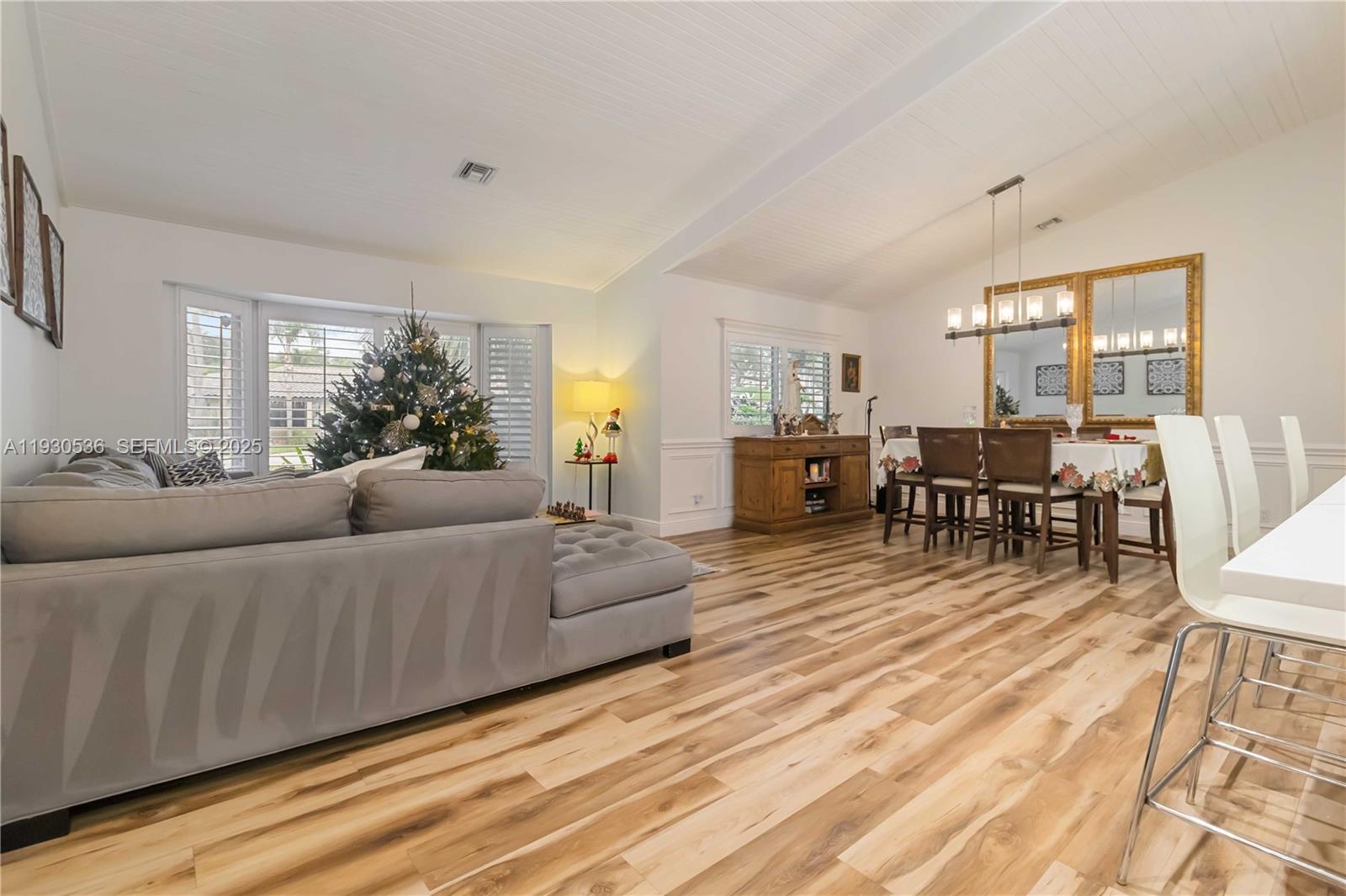 2047 Southwest 36th Avenue Delray Beach, FL 33445 - Photo 10 of 45 a living room with furniture and wooden floor