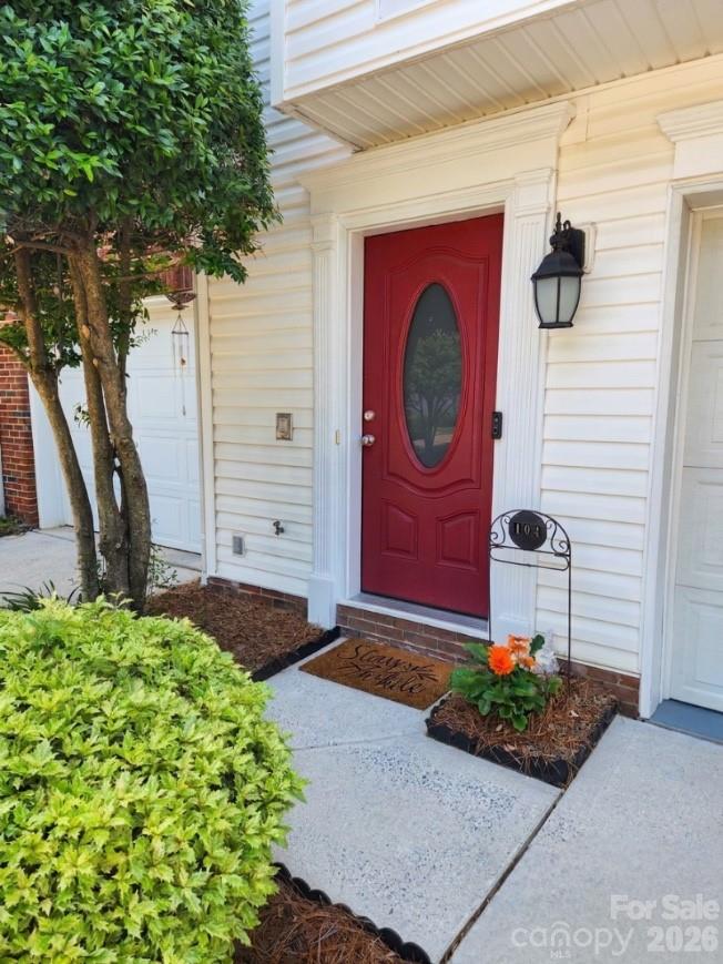 104 Rock Ridge Lane Mount Holly, NC 28120 - Photo 2 of 48 a front view of a house with garden