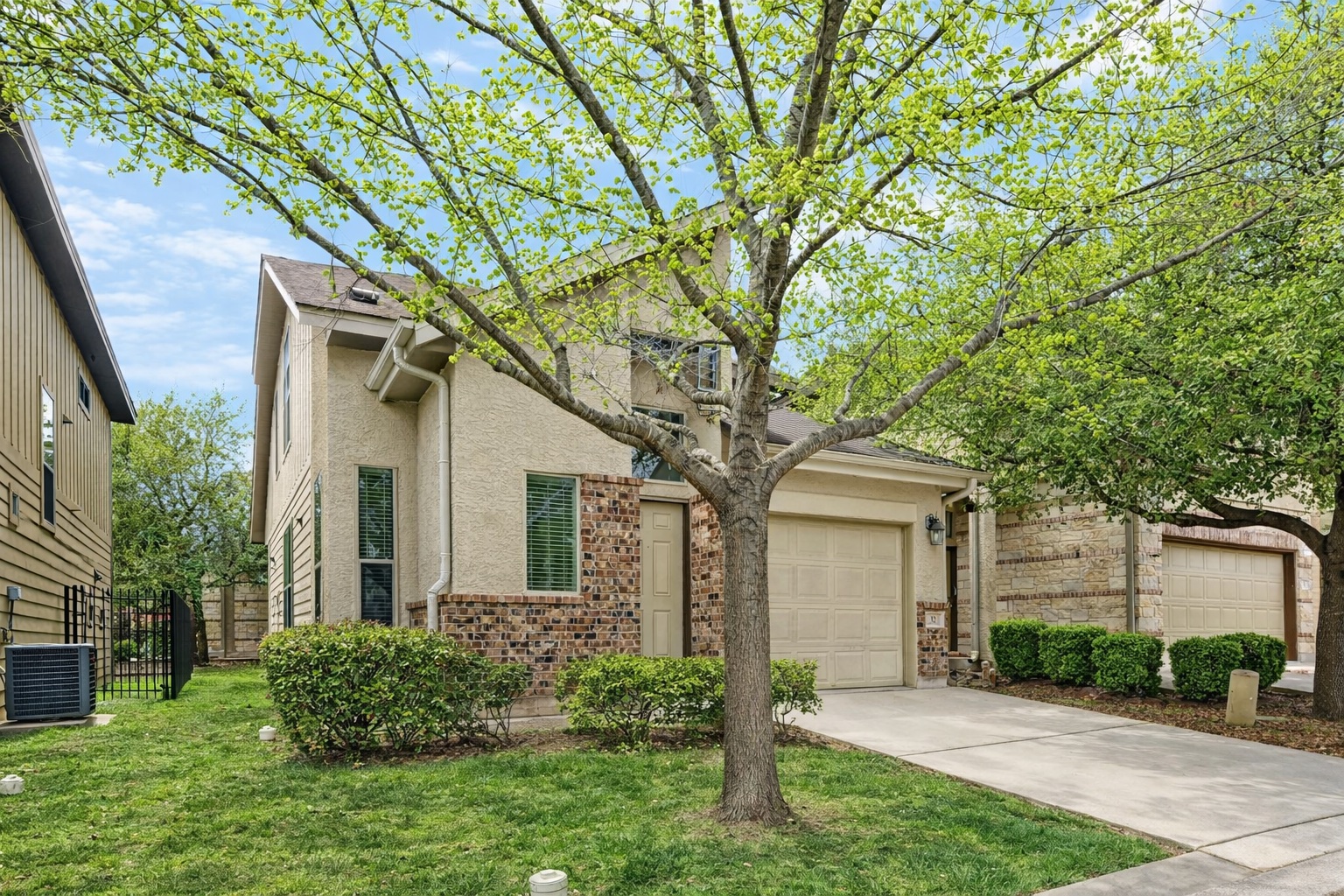 2101 Rivers Edge Way, Unit 32 Austin, TX 78741 - Photo 2 of 24 Two-story with primary bedroom down, detached condo. Lawn is virtually greened up.