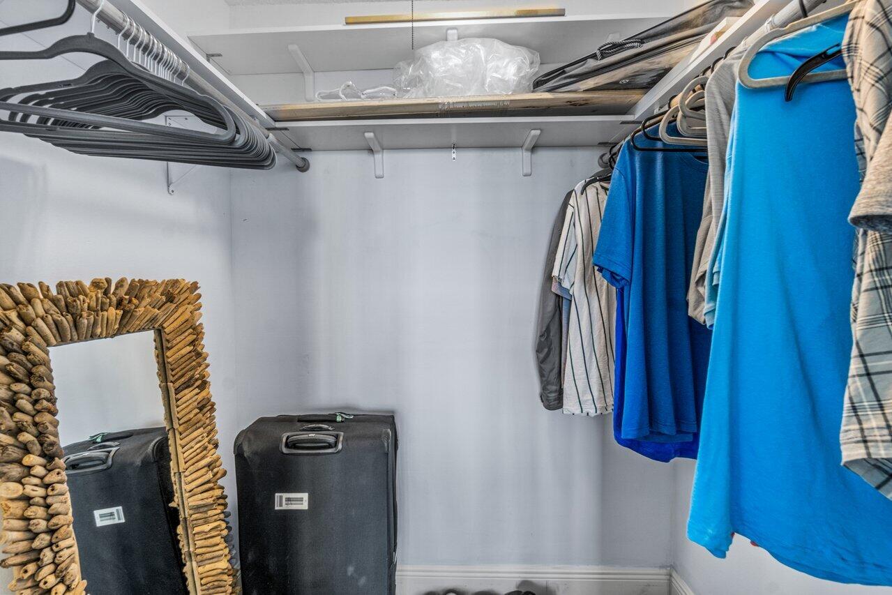 14 Royal Palm Way, Unit 504 Boca Raton, FL 33432 - Photo 17 of 22 a view of walk in closet with clothes and shoes