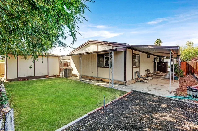 a view of two chairs in the balcony