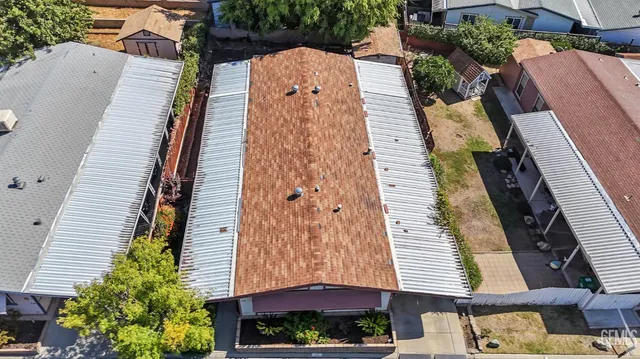 aerial view of a house with a tree