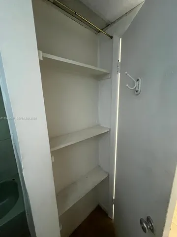 a bathroom with a toilet and shower