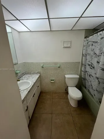 a view of walk in closet with wooden floor
