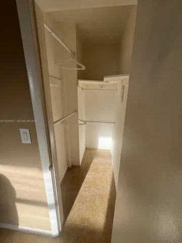 a kitchen with a sink a counter top space and cabinets