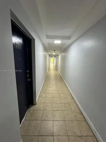 a view of swimming pool with sitting area