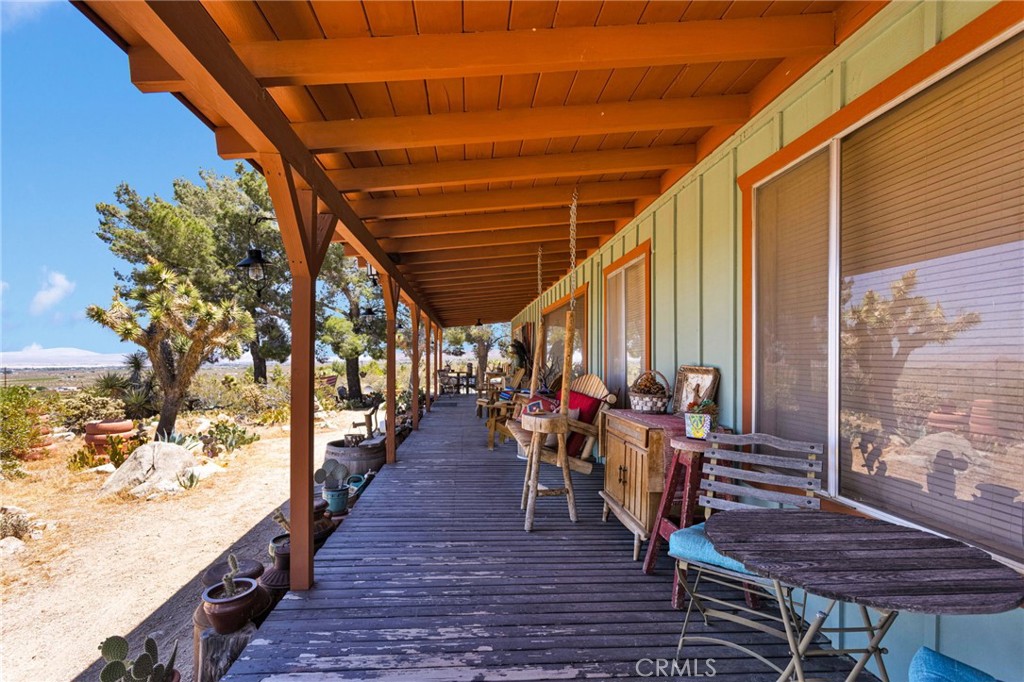 29229 Santa Rosa Road Lucerne Valley, CA 92356 - Photo 12 of 74 a view of a chairs and table on the wooden floor