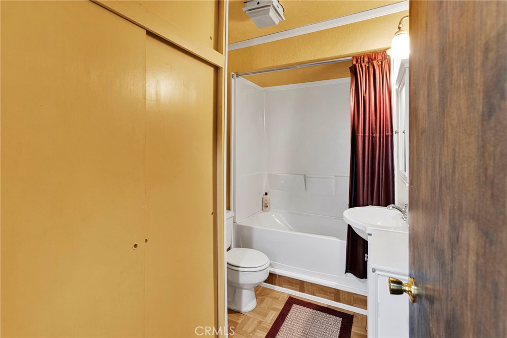29229 Santa Rosa Road Lucerne Valley, CA 92356 - Photo 35 of 74 a bathroom with a toilet and a shower