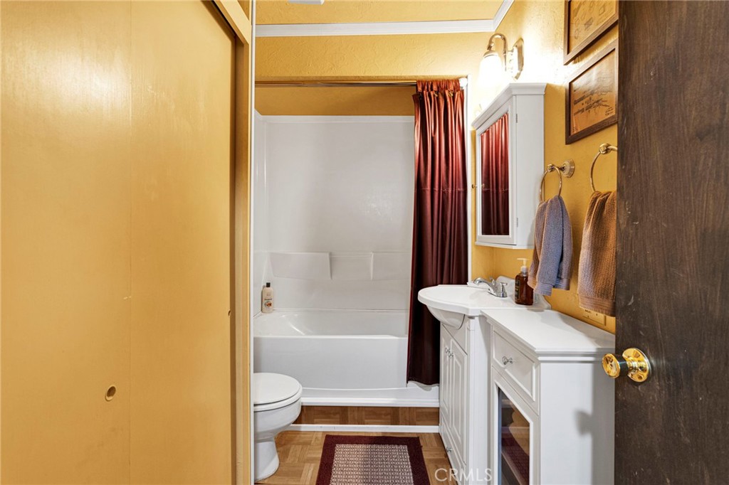29229 Santa Rosa Road Lucerne Valley, CA 92356 - Photo 36 of 74 a bathroom with a sink a toilet and shower