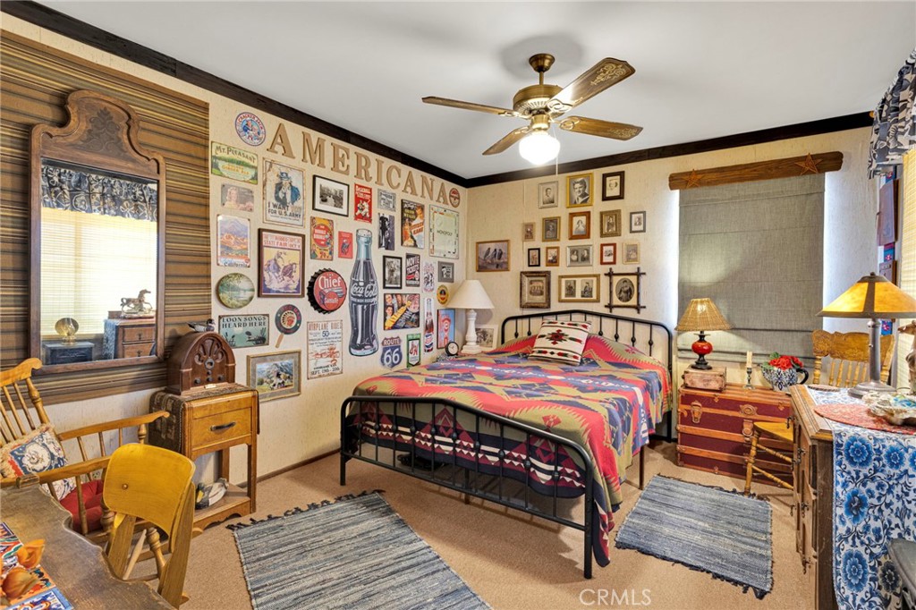 29229 Santa Rosa Road Lucerne Valley, CA 92356 - Photo 38 of 74 a bedroom with a bed and wooden floor