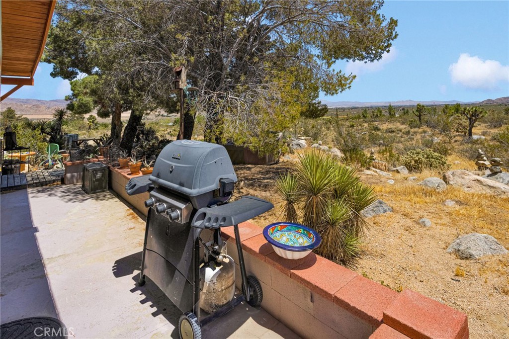 29229 Santa Rosa Road Lucerne Valley, CA 92356 - Photo 53 of 74 a backyard of a house with table and chairs