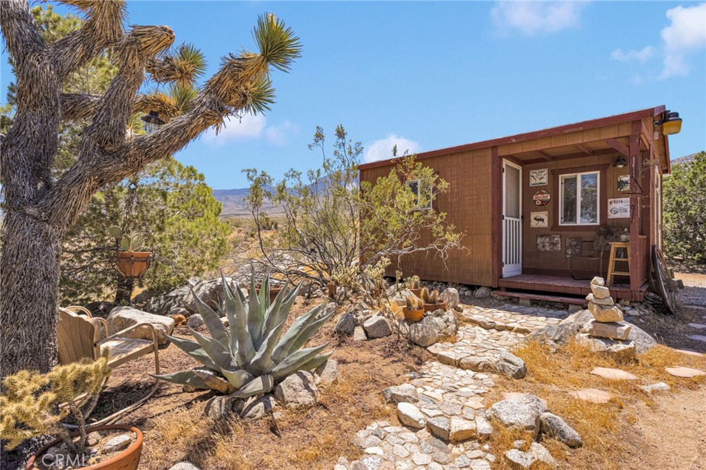 29229 Santa Rosa Road Lucerne Valley, CA 92356 - Photo 56 of 74 a view of a house with a yard