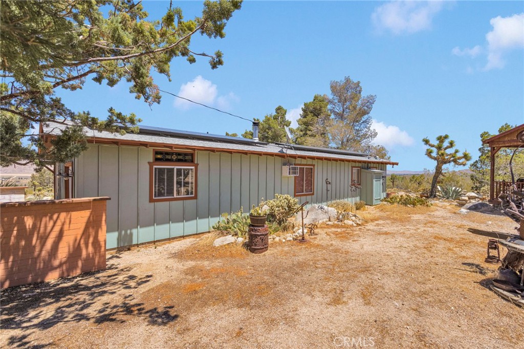 29229 Santa Rosa Road Lucerne Valley, CA 92356 - Photo 61 of 74 a view of a backyard with a patio