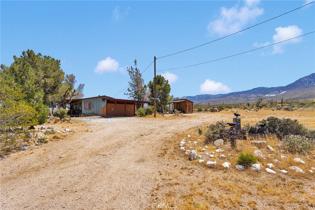 29229 Santa Rosa Road Lucerne Valley, CA 92356 - Photo 64 of 74 a view of a house with a yard