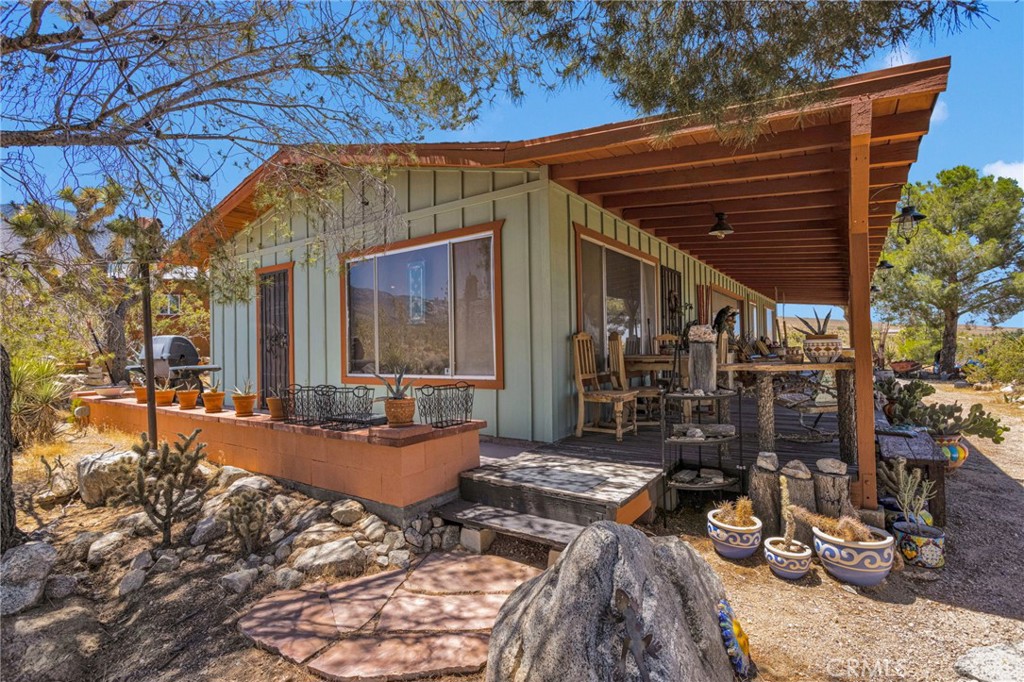 29229 Santa Rosa Road Lucerne Valley, CA 92356 - Photo 10 of 74 a view of a house with backyard and sitting area