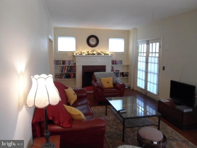 5107 Roland Avenue Baltimore, MD 21210 - Photo 17 of 45 living room 7 door to private porch- 1F