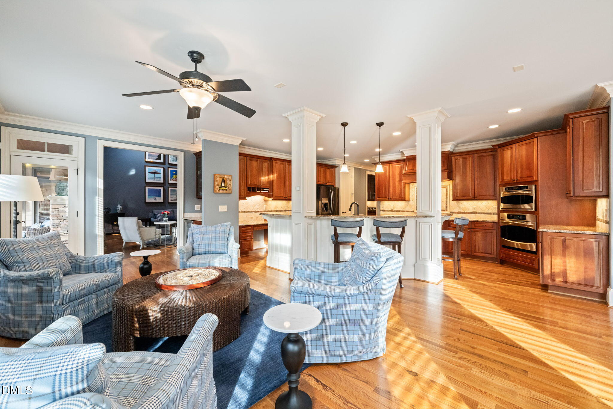 12313 The Gates Drive Raleigh, NC 27614 - Photo 16 of 78 a living room with furniture kitchen view and a wooden floor