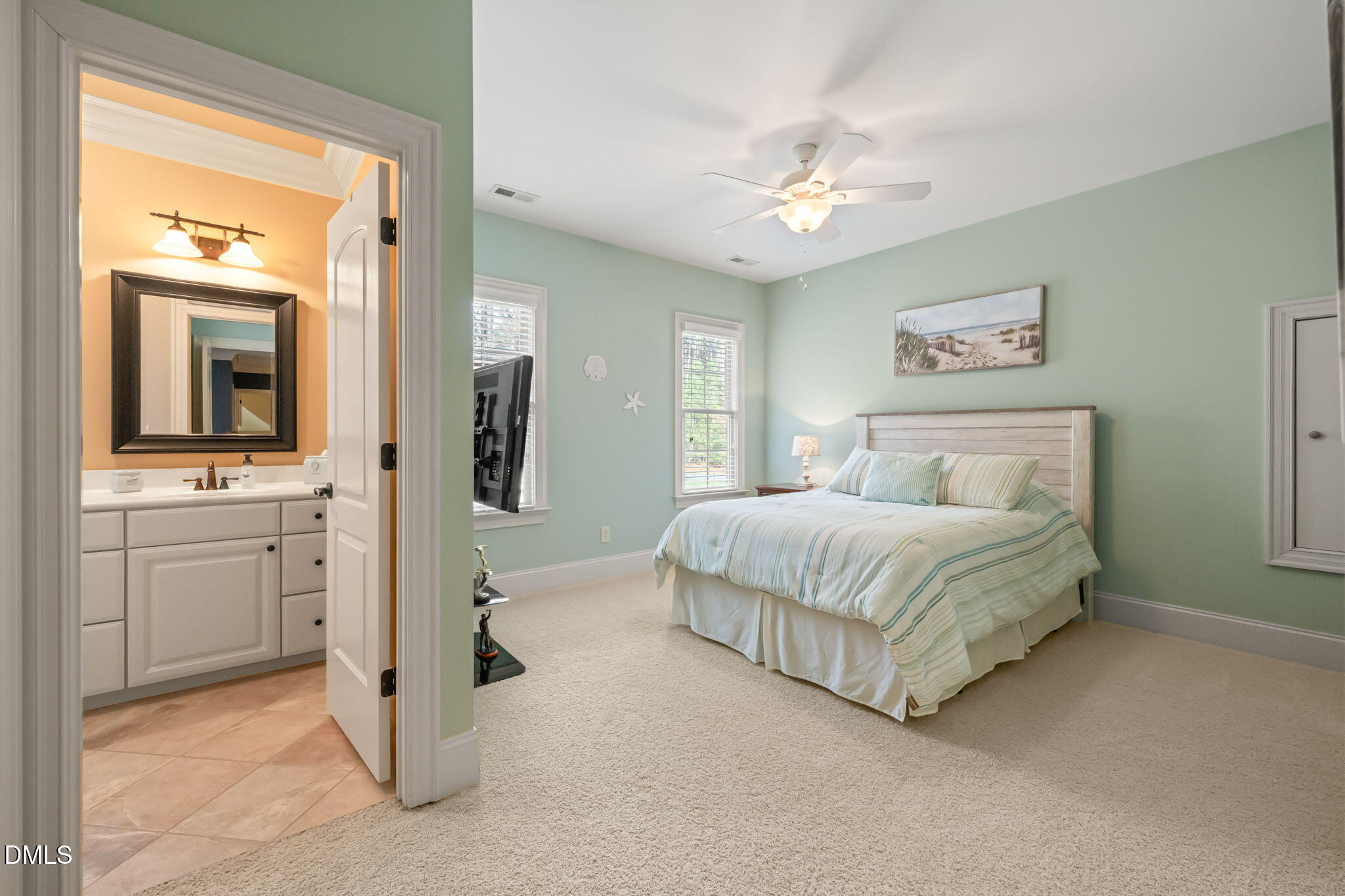 12313 The Gates Drive Raleigh, NC 27614 - Photo 38 of 78 a spacious bedroom with a bed and a chandelier