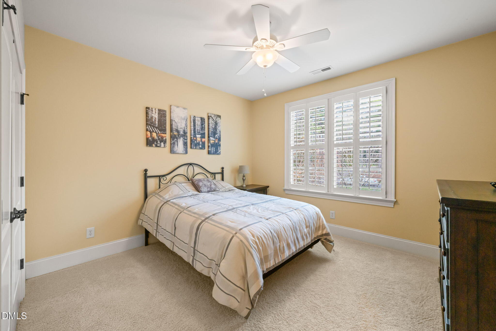 12313 The Gates Drive Raleigh, NC 27614 - Photo 40 of 78 a spacious bedroom with a bed and a window