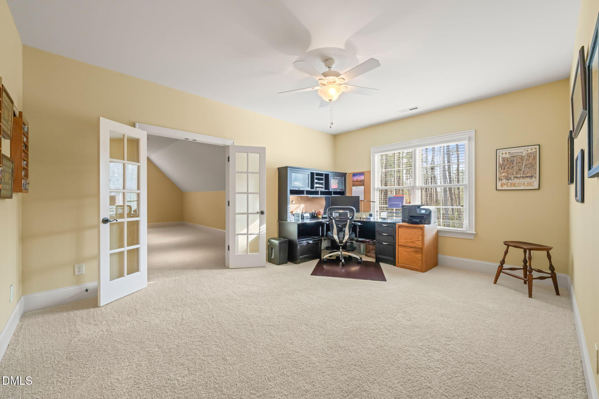 12313 The Gates Drive Raleigh, NC 27614 - Photo 43 of 78 a view of a livingroom with workspace and a couch