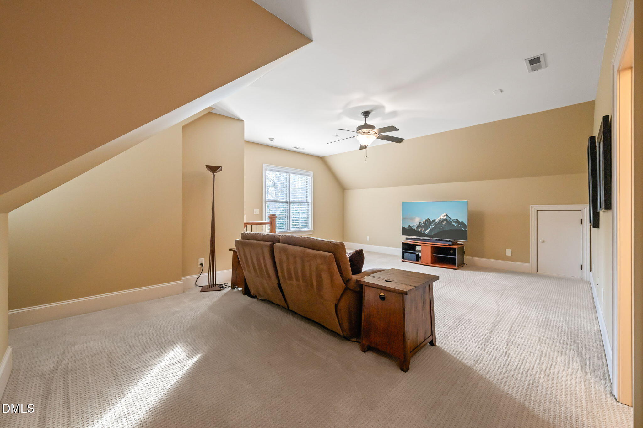 12313 The Gates Drive Raleigh, NC 27614 - Photo 48 of 78 a living room with furniture and a chandelier