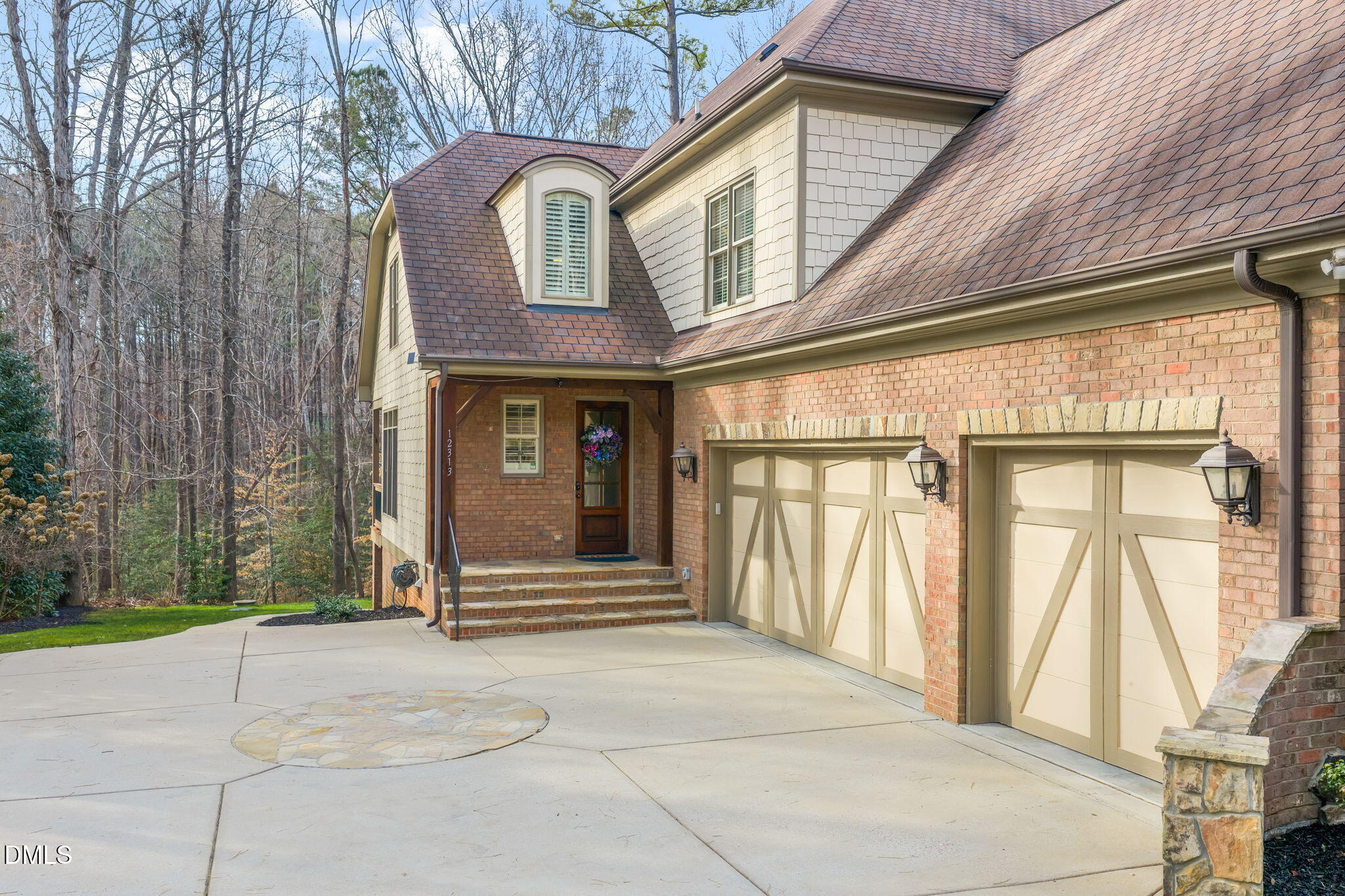 12313 The Gates Drive Raleigh, NC 27614 - Photo 65 of 78 a front view of a building with a garden