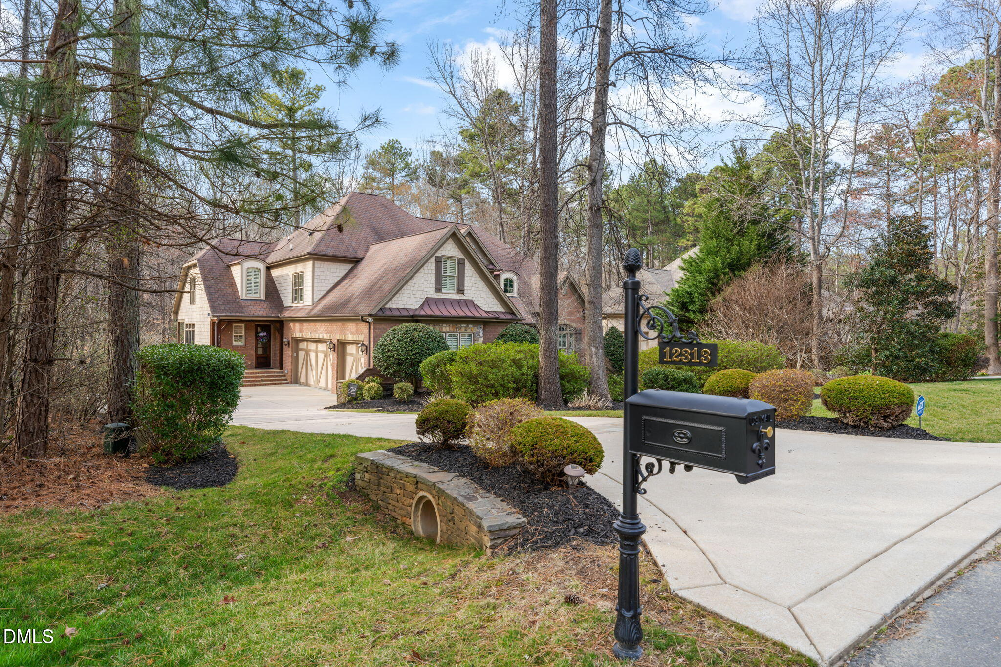 12313 The Gates Drive Raleigh, NC 27614 - Photo 67 of 78 a front view of a house with garden and sitting area