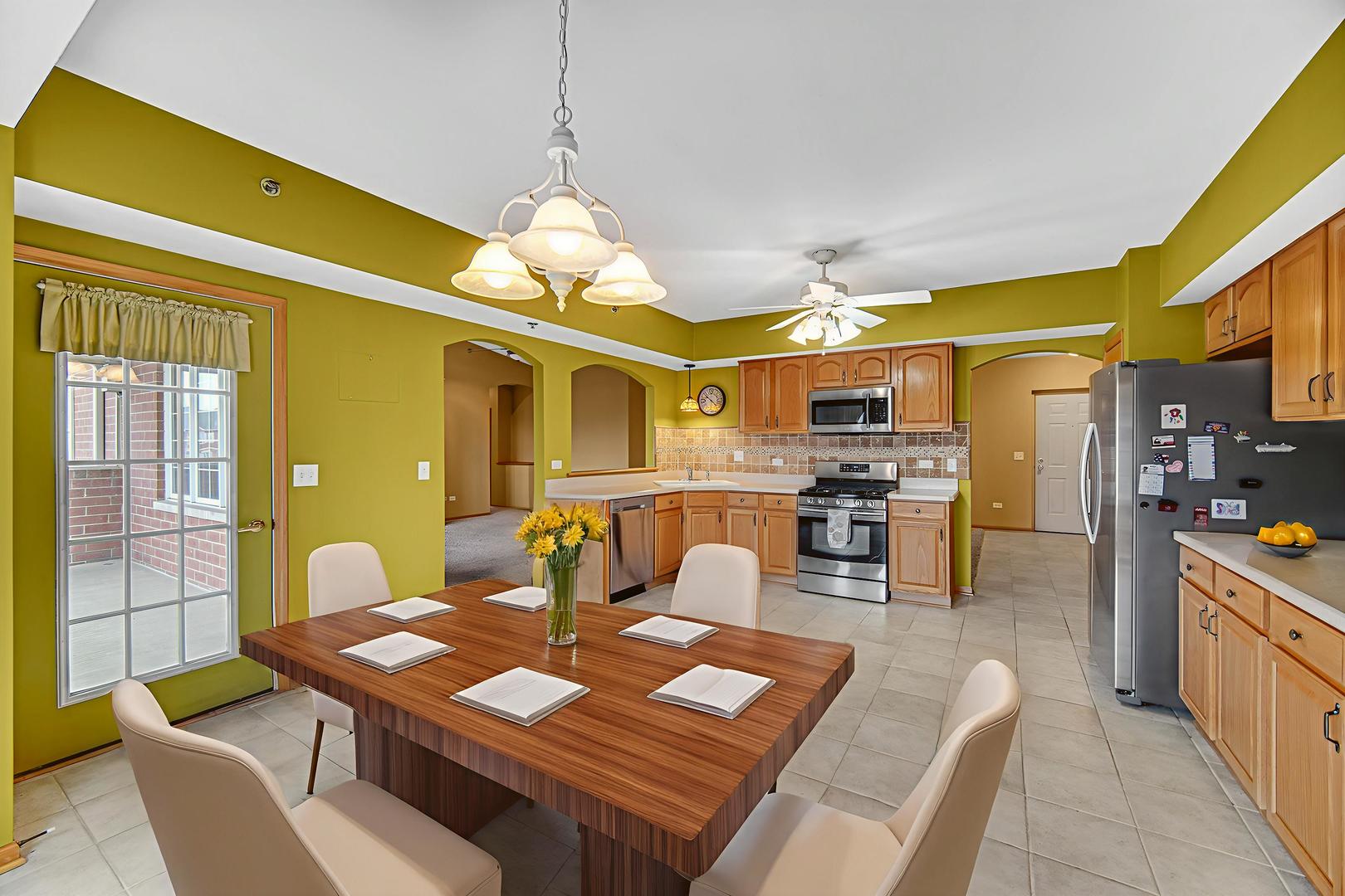 7920 Trinity Circle, Unit 4SW Tinley Park, IL 60487 - Photo 12 of 30 a view of a dining room with furniture and wooden floor