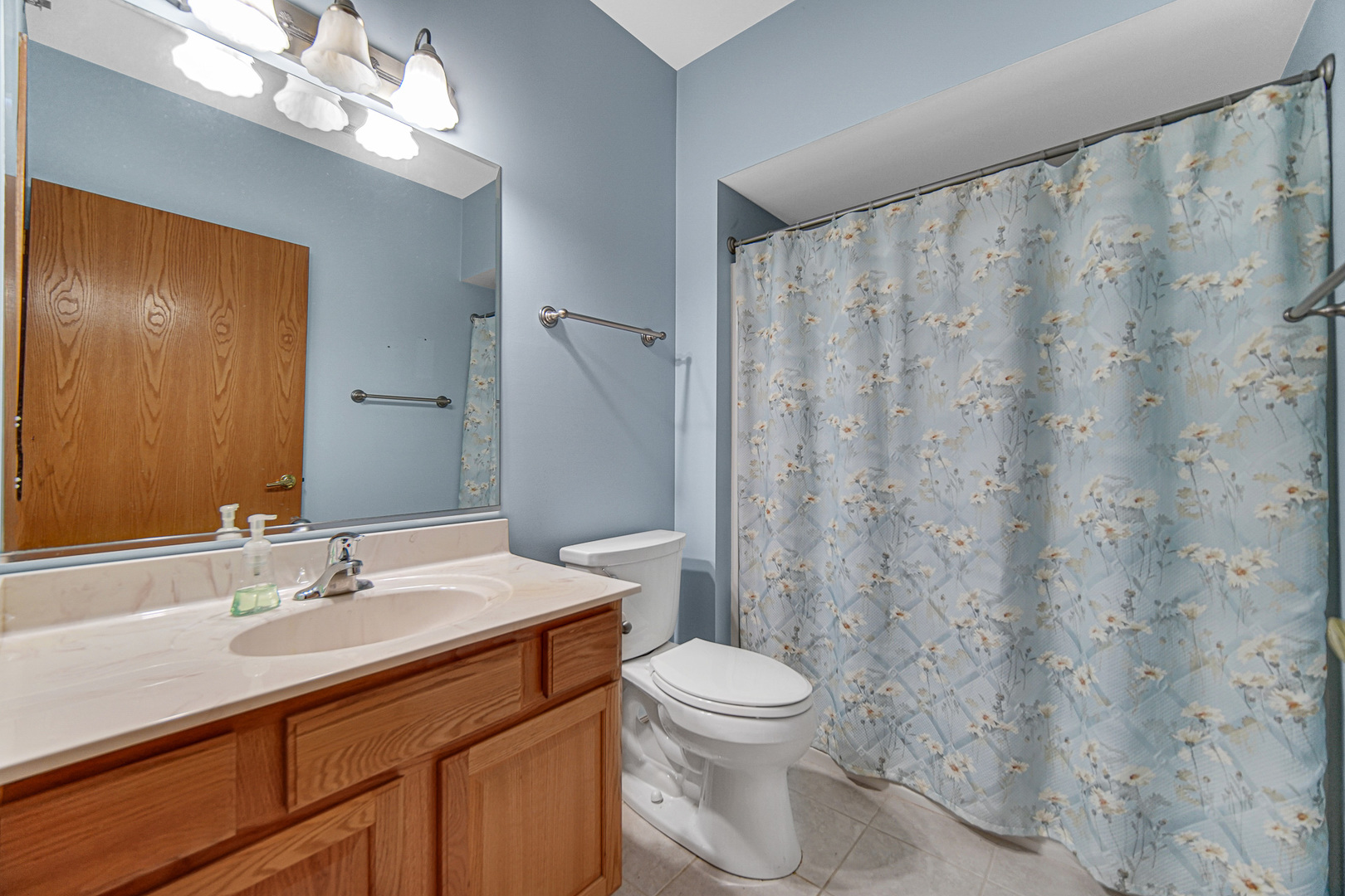 7920 Trinity Circle, Unit 4SW Tinley Park, IL 60487 - Photo 22 of 30 a bathroom with a toilet a sink and a mirror