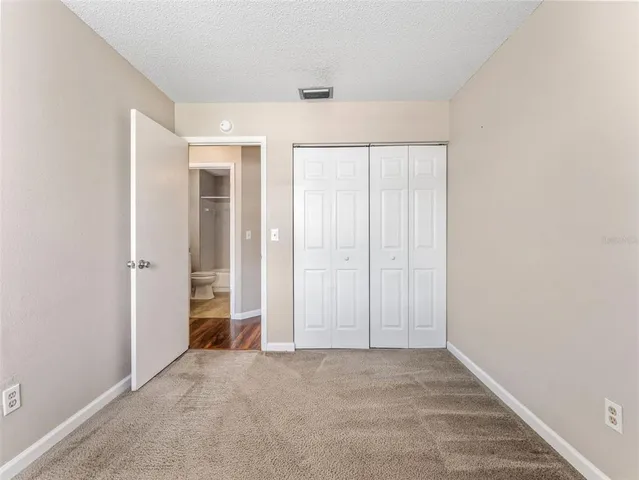 an empty room with entrance door