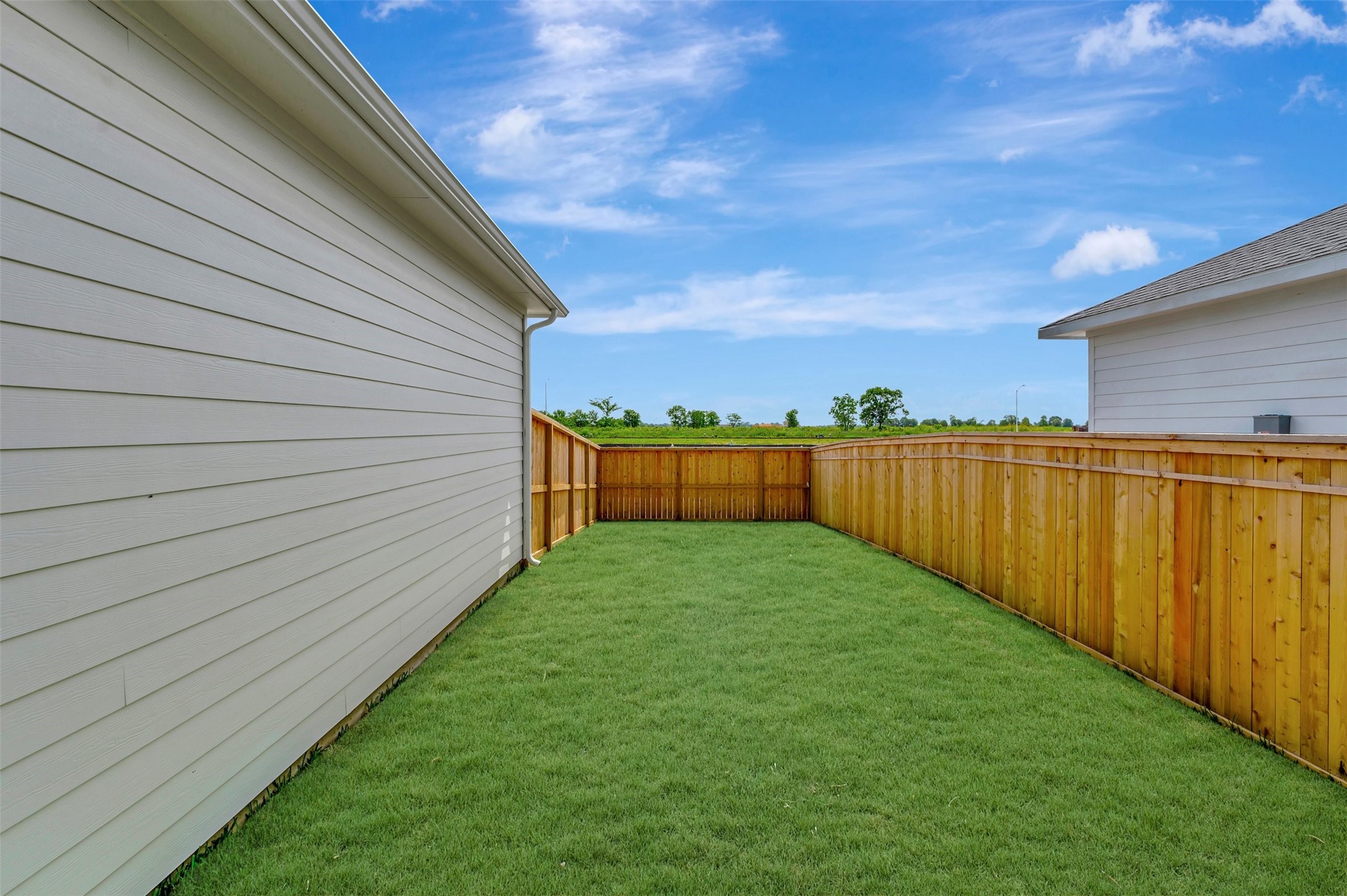 2718 Cottage Place Rosharon, TX 77583 - Photo 8 of 50 a view of a backyard with wooden fence