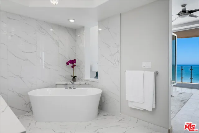 a white bath tub sitting in a bathroom