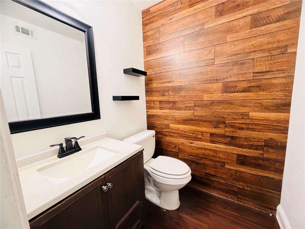 434 Moonlight Way Irving, TX 75063 - Photo 22 of 29 a bathroom with a sink and a mirror