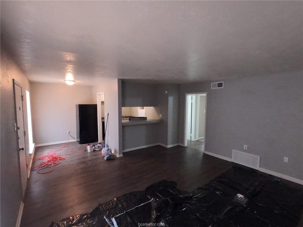 3300 South College Avenue, Unit A05 Bryan, TX 77801 - Photo 3 of 15 a view of kitchen with windows and refrigerator