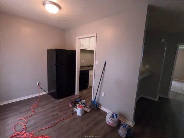 a view of an entryway with wooden floor