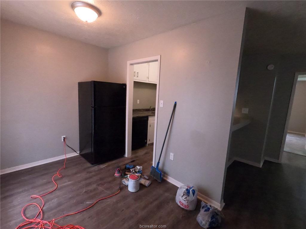 3300 South College Avenue, Unit A05 Bryan, TX 77801 - Photo 5 of 15 a view of an entryway with wooden floor