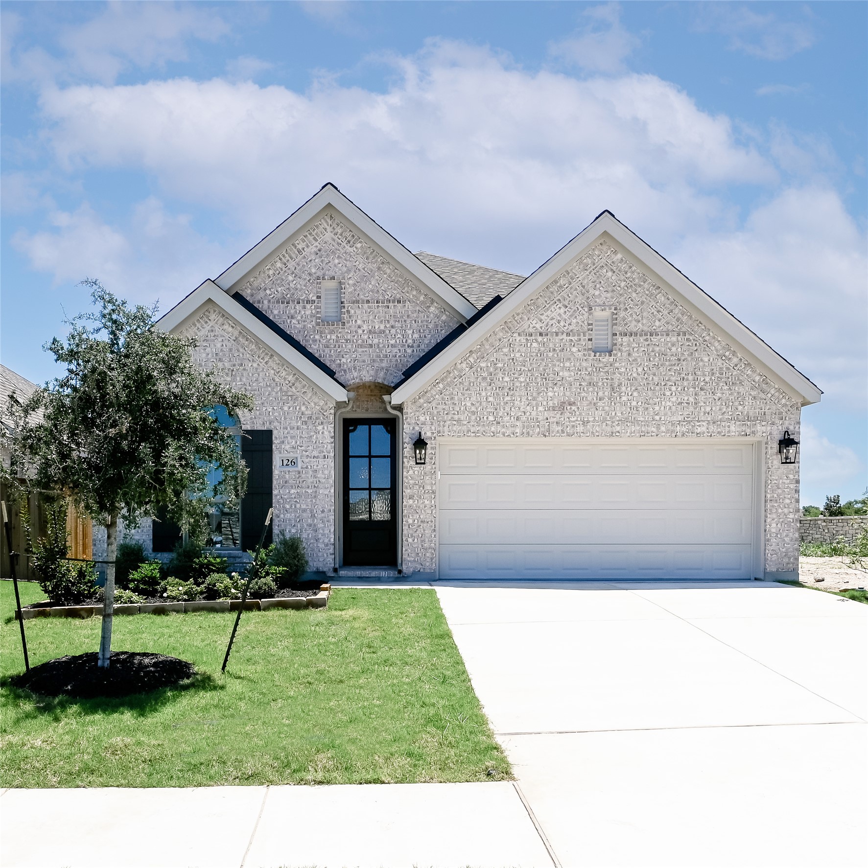 126 Basket Flower Loop Kyle, TX 78640 - Photo 1 of 29 a front view of a house with a yard