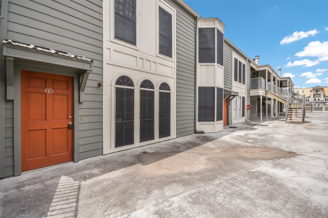 2529 Rio Grande Street, Unit 85 Austin, TX 78705 - Photo 1 of 31 a view of a blue house with large windows