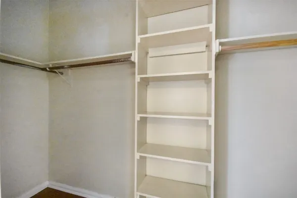 a view of an empty walk in closet