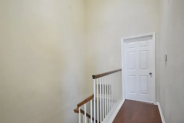 a view of a hallway with a door
