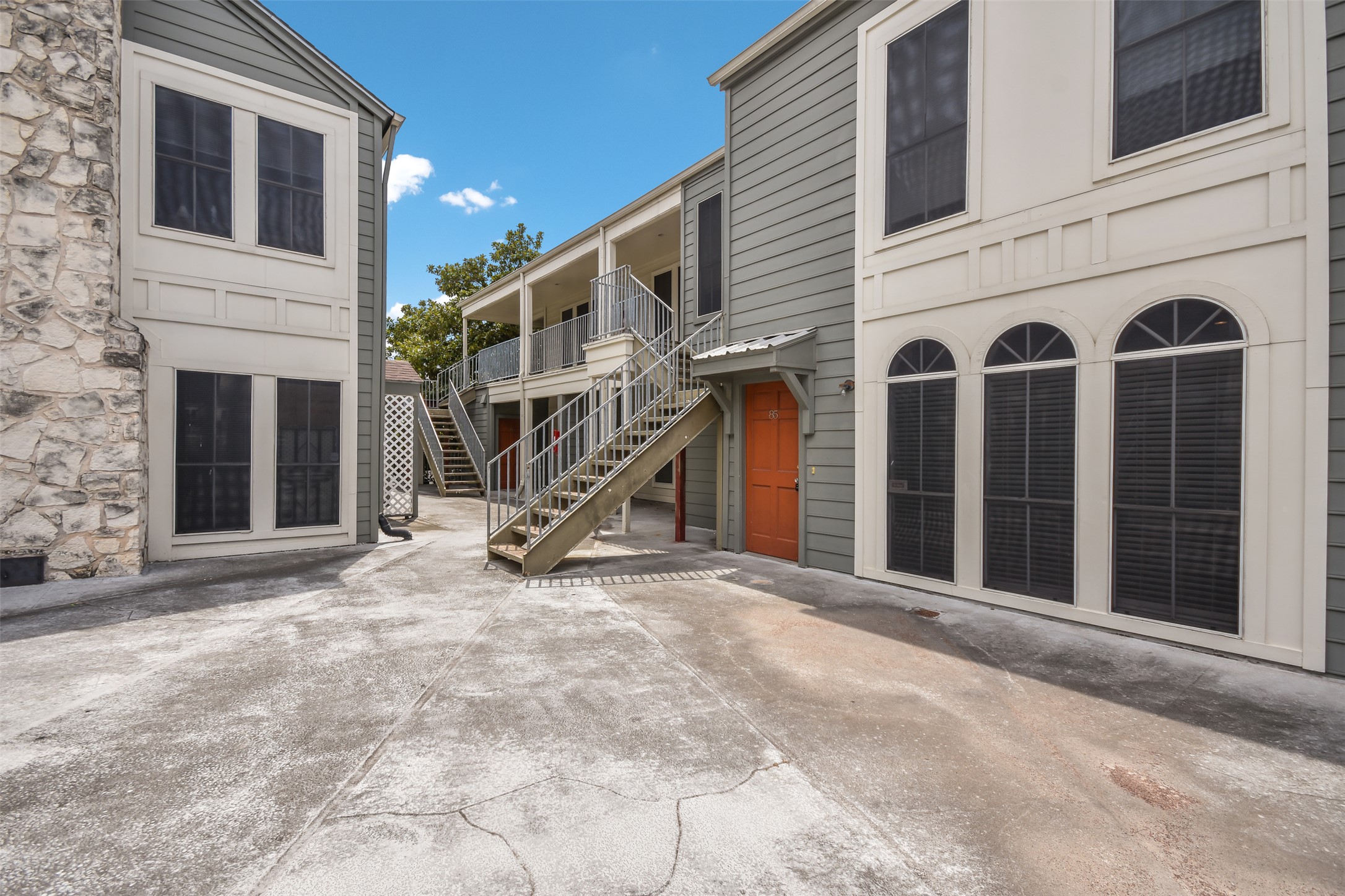 2529 Rio Grande Street, Unit 85 Austin, TX 78705 - Photo 2 of 31 a view of a house with a wooden fence