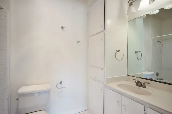 a bathroom with a sink toilet and vanity